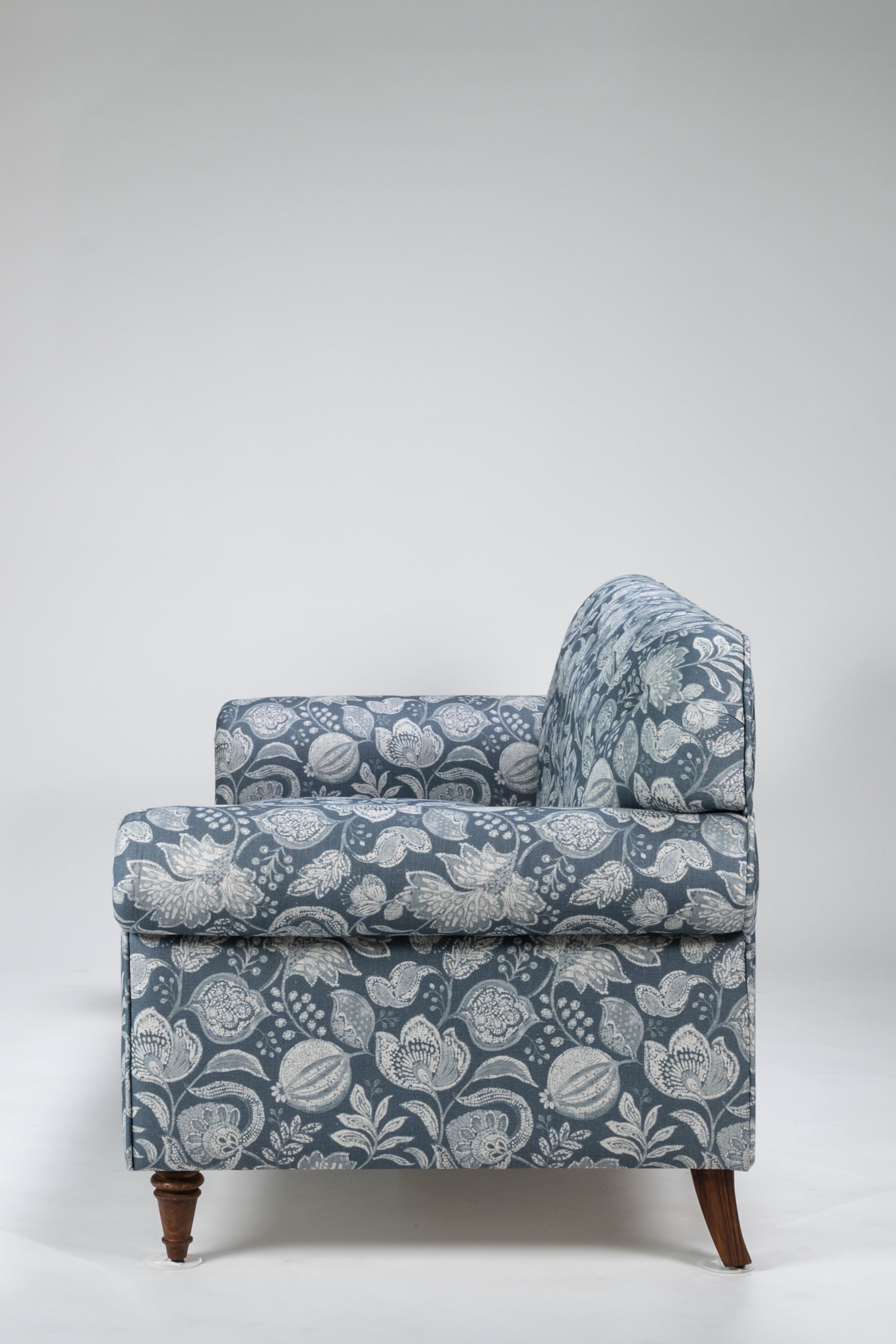 Floral patterned armchair on a white background