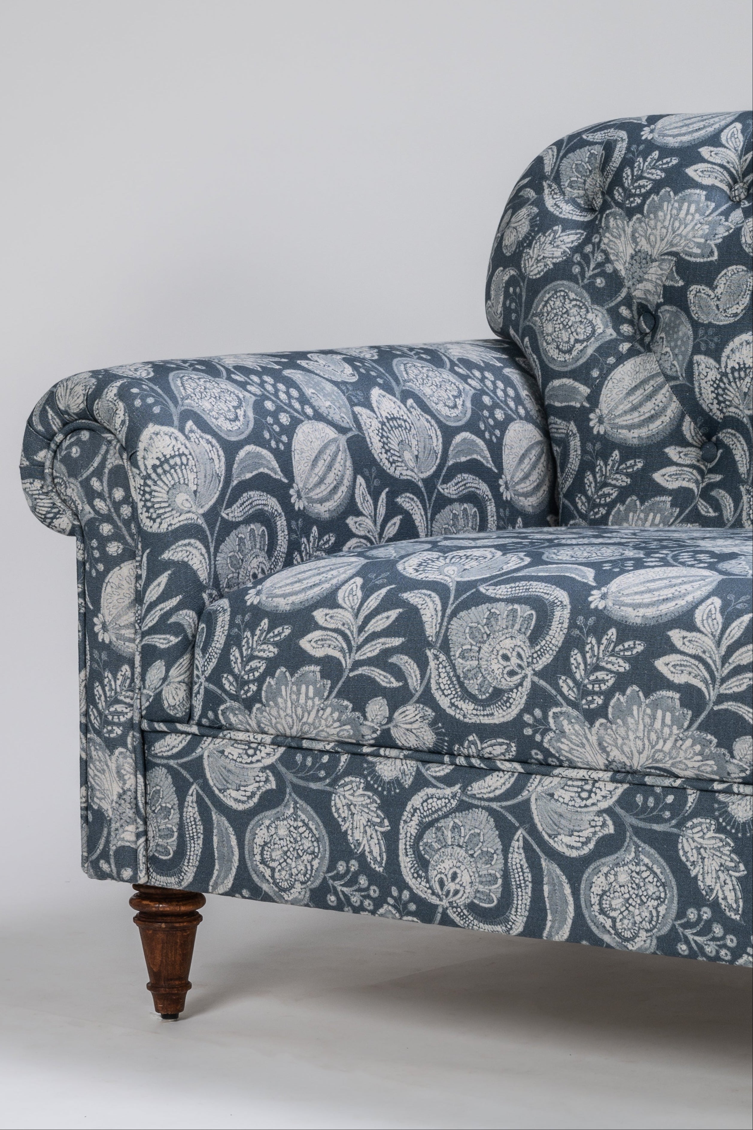 Floral patterned armchair on a white background