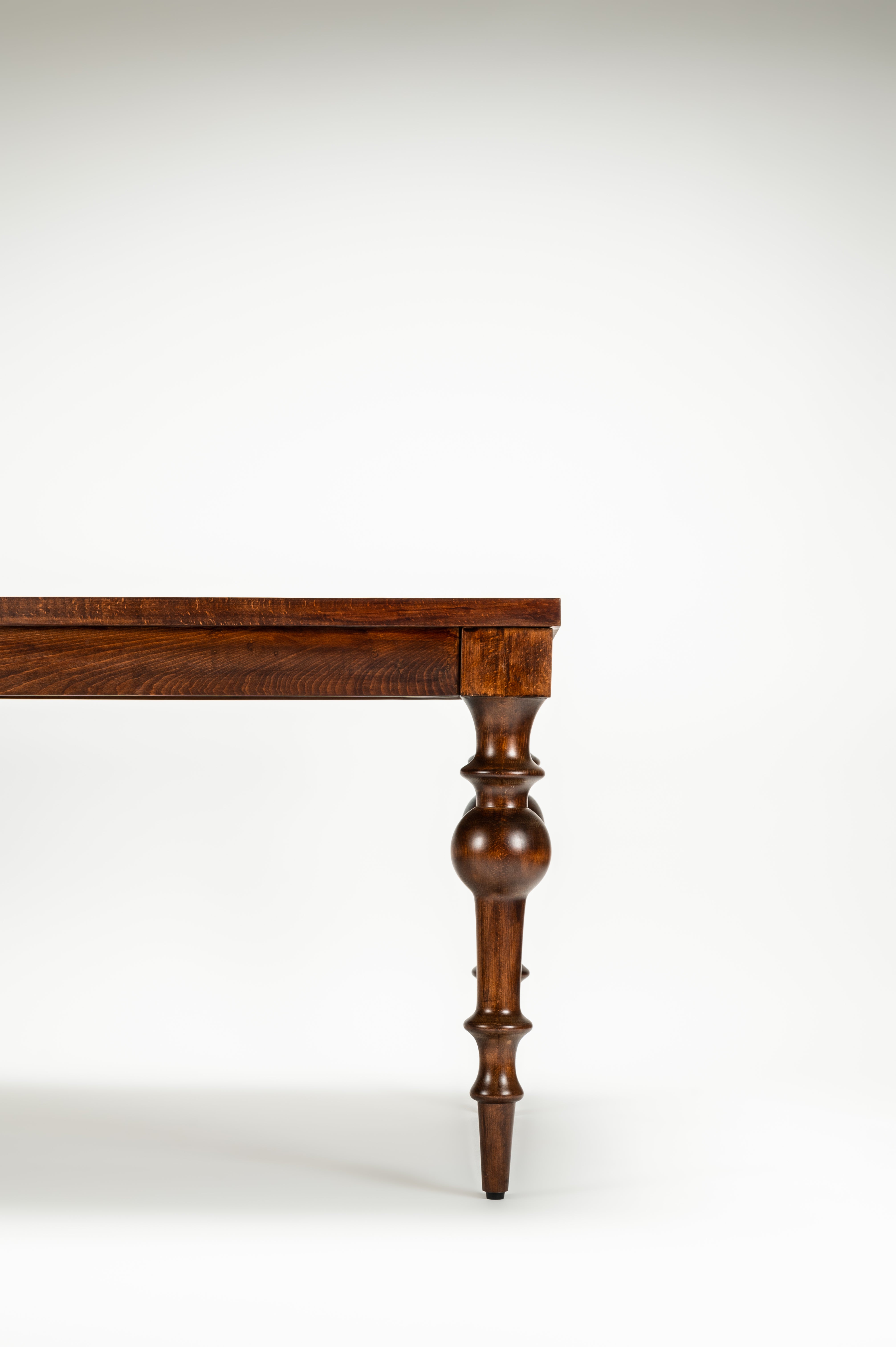 Wooden table leg on a white background