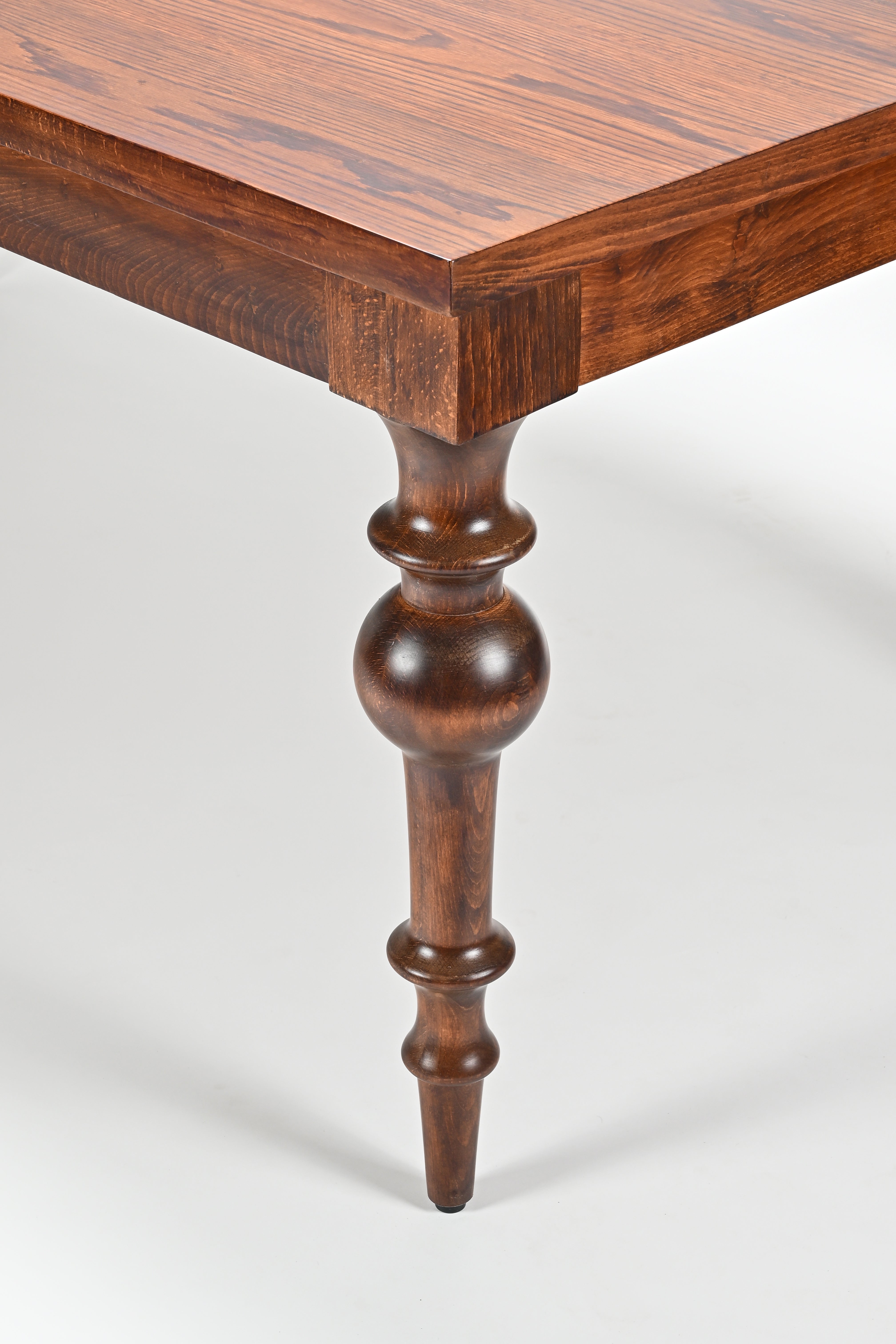 Wooden table with a single leg on a white background