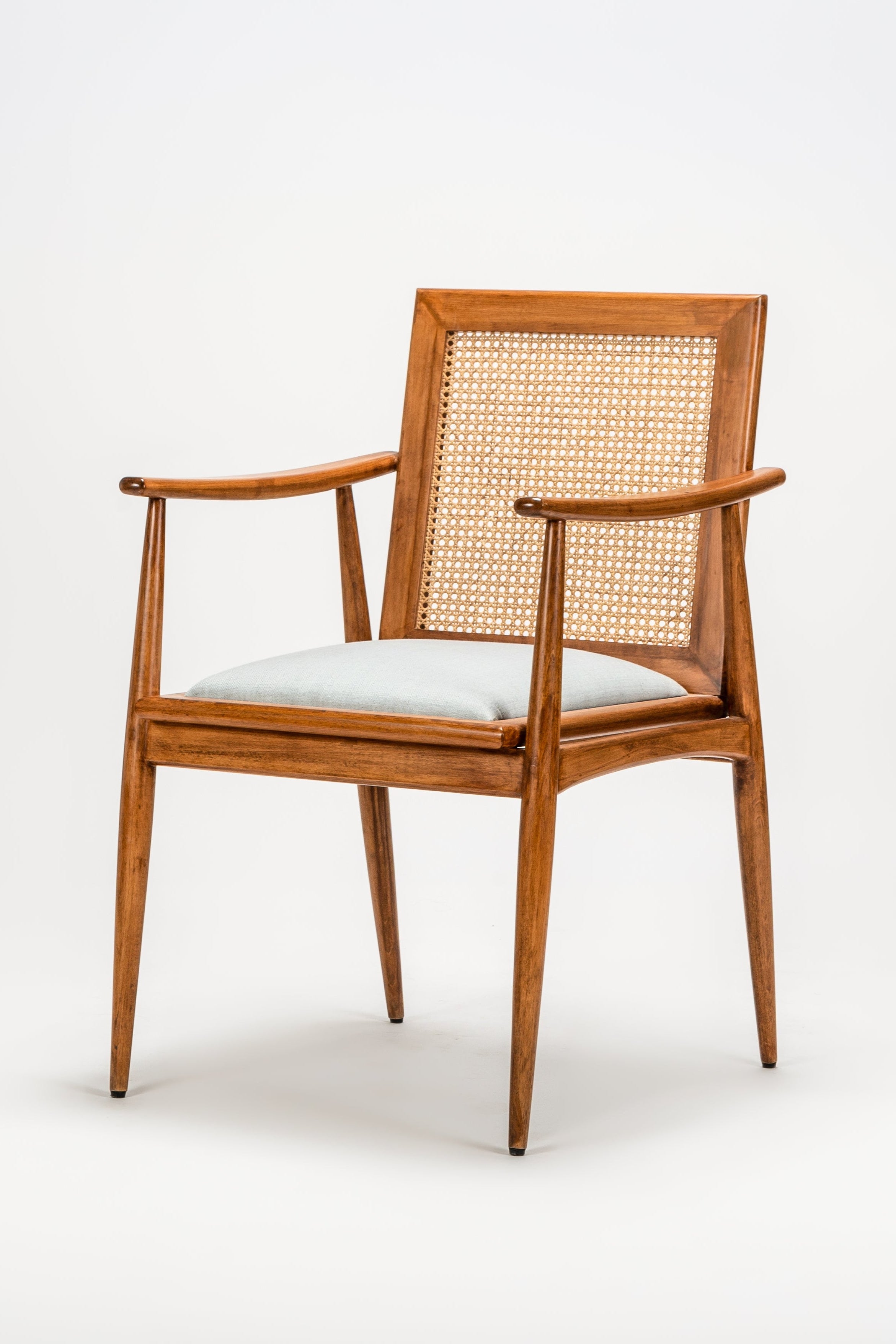 Wooden chair with woven backrest on a white background