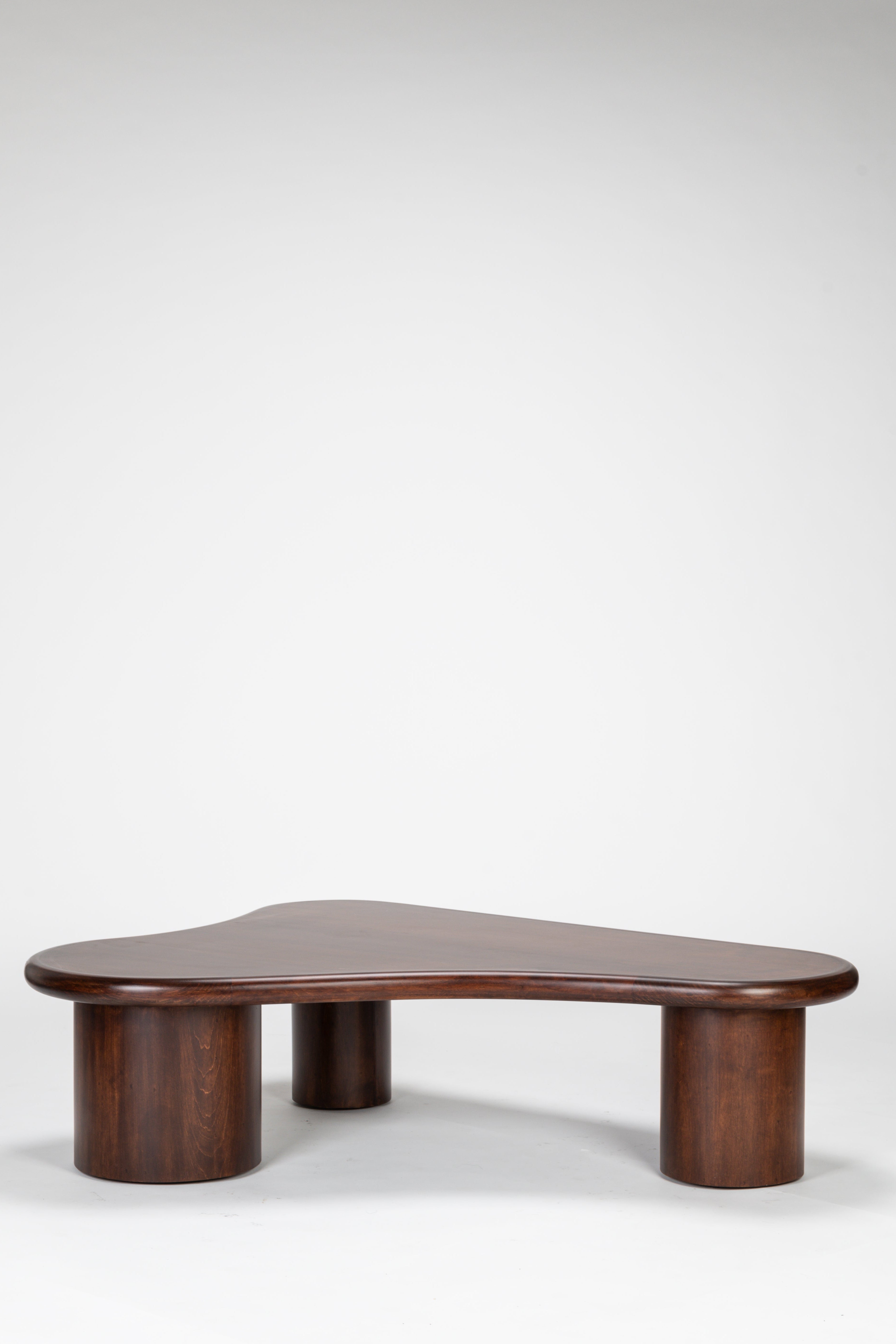 Wooden coffee table with a unique design on a white background