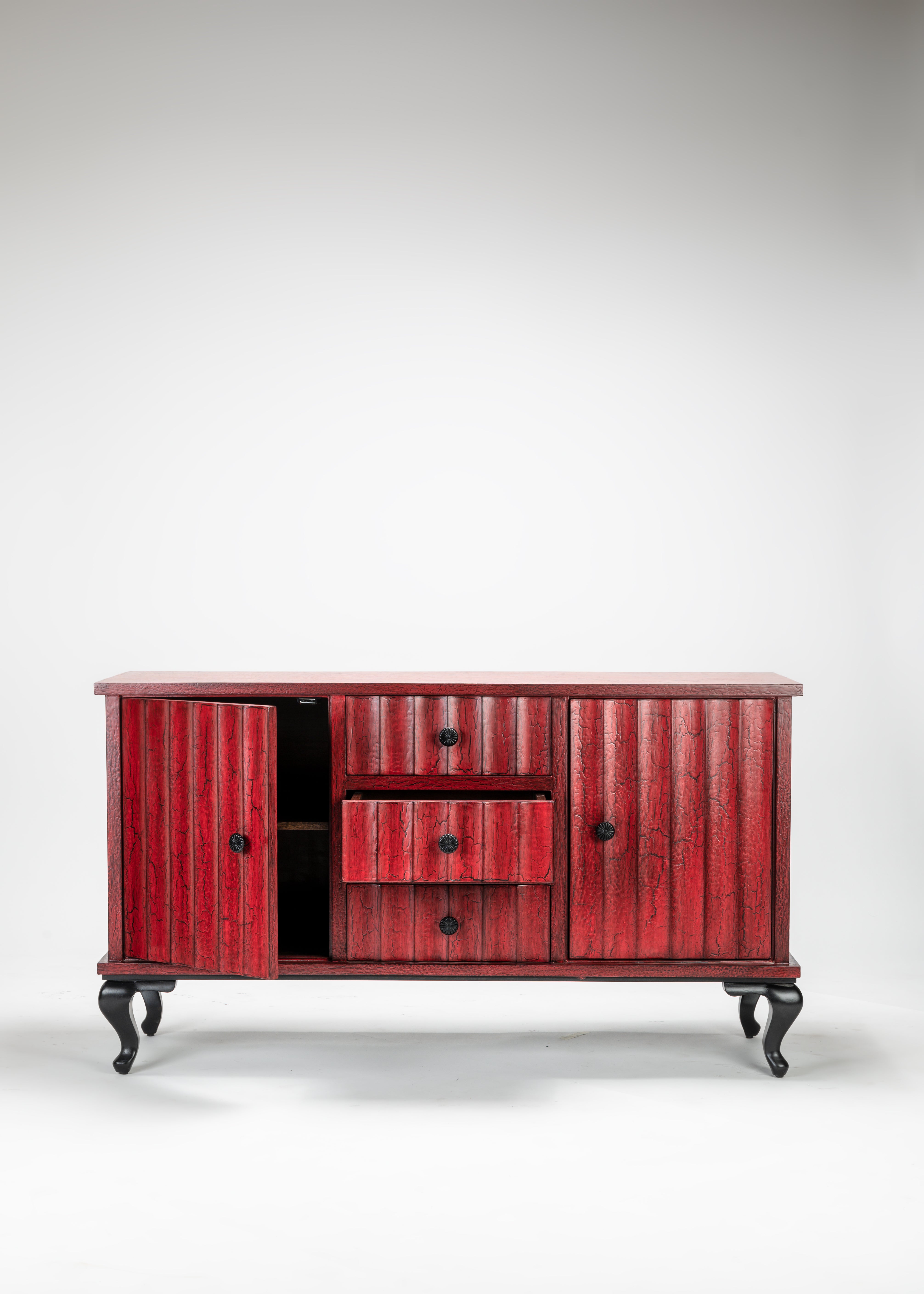 Red wooden sideboard with black legs on a white background