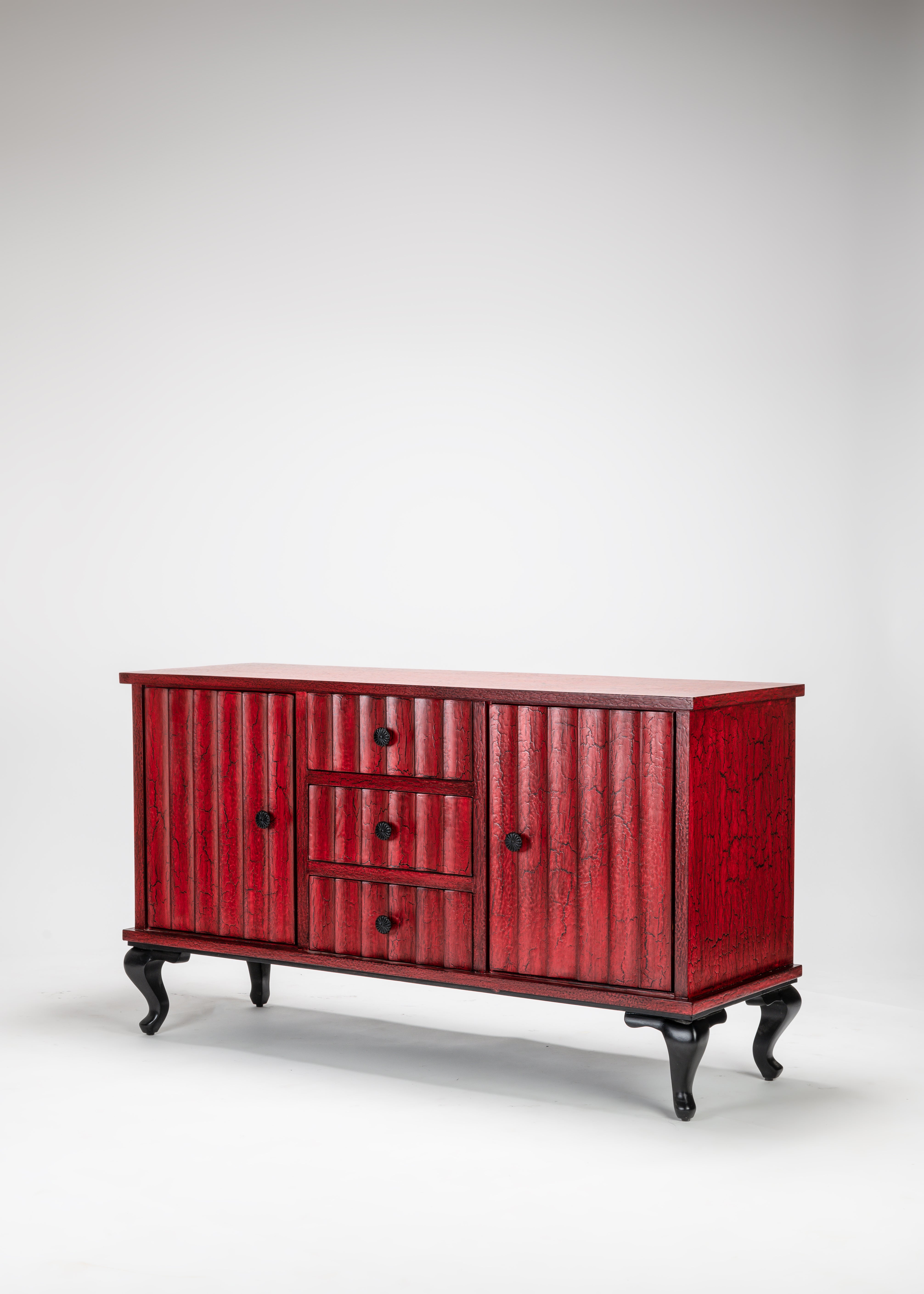 Red wooden sideboard with black legs on a white background