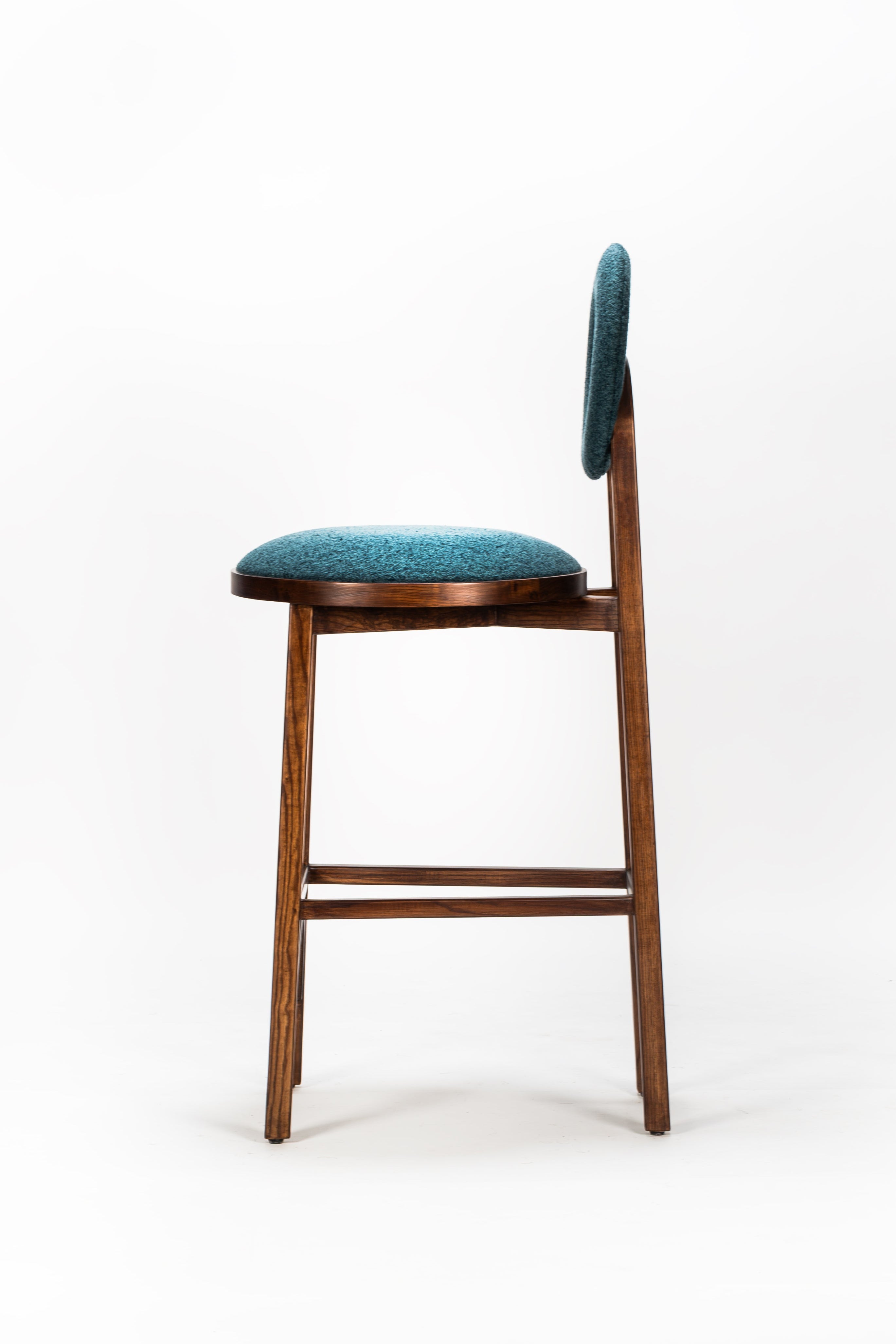 Bar stool with wooden frame and teal cushioned seat on a white background