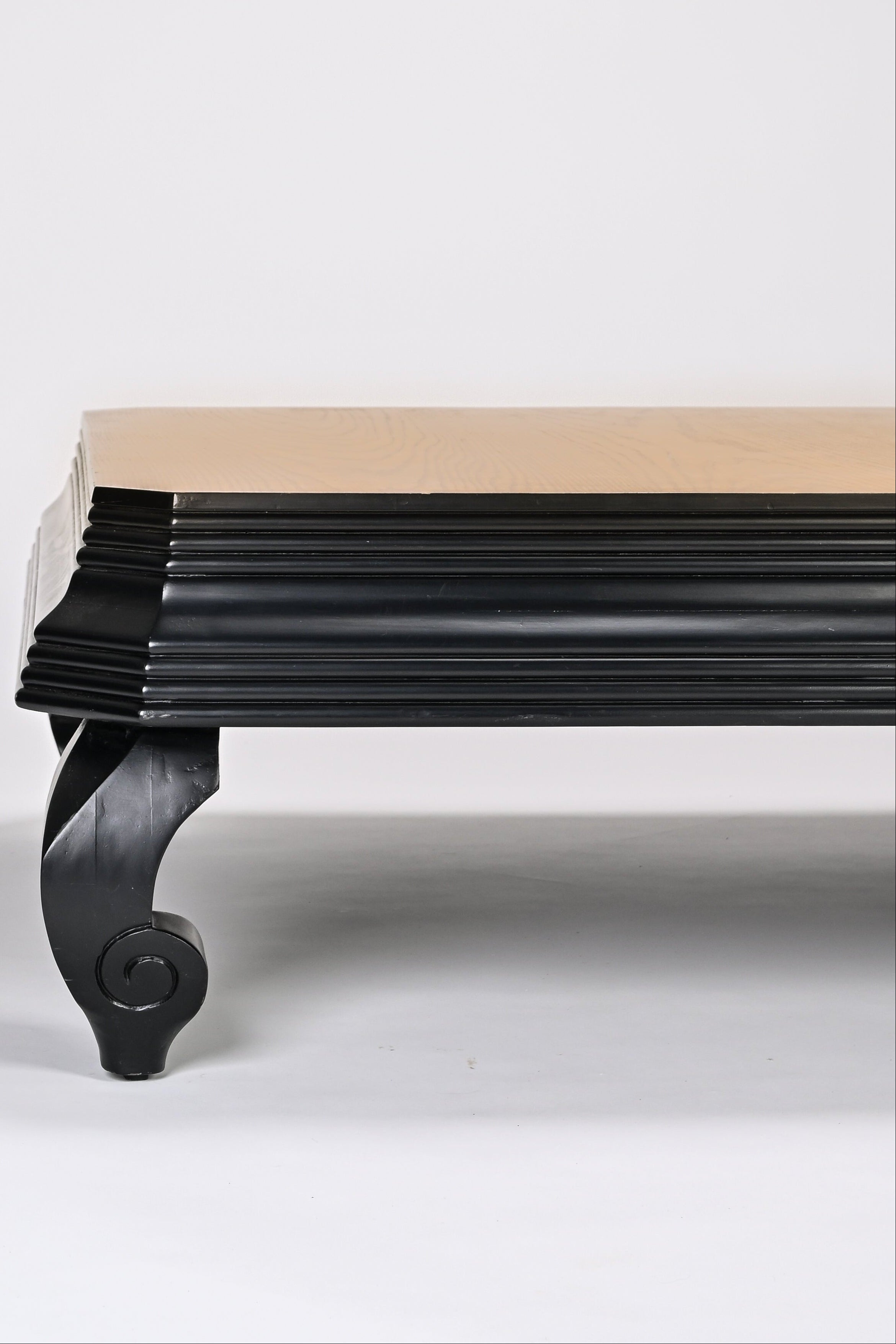 Wooden bench with black metal legs on a white background