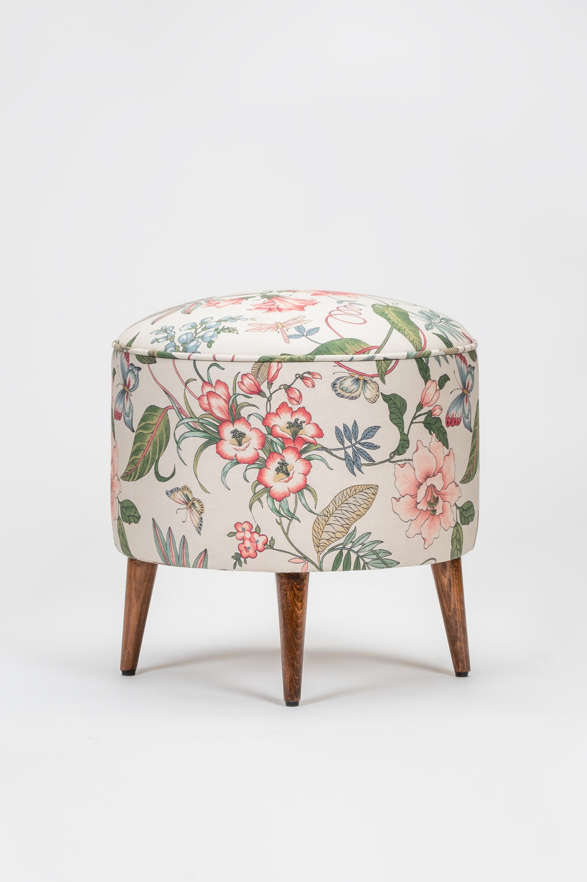 Floral-patterned ottoman on a white background