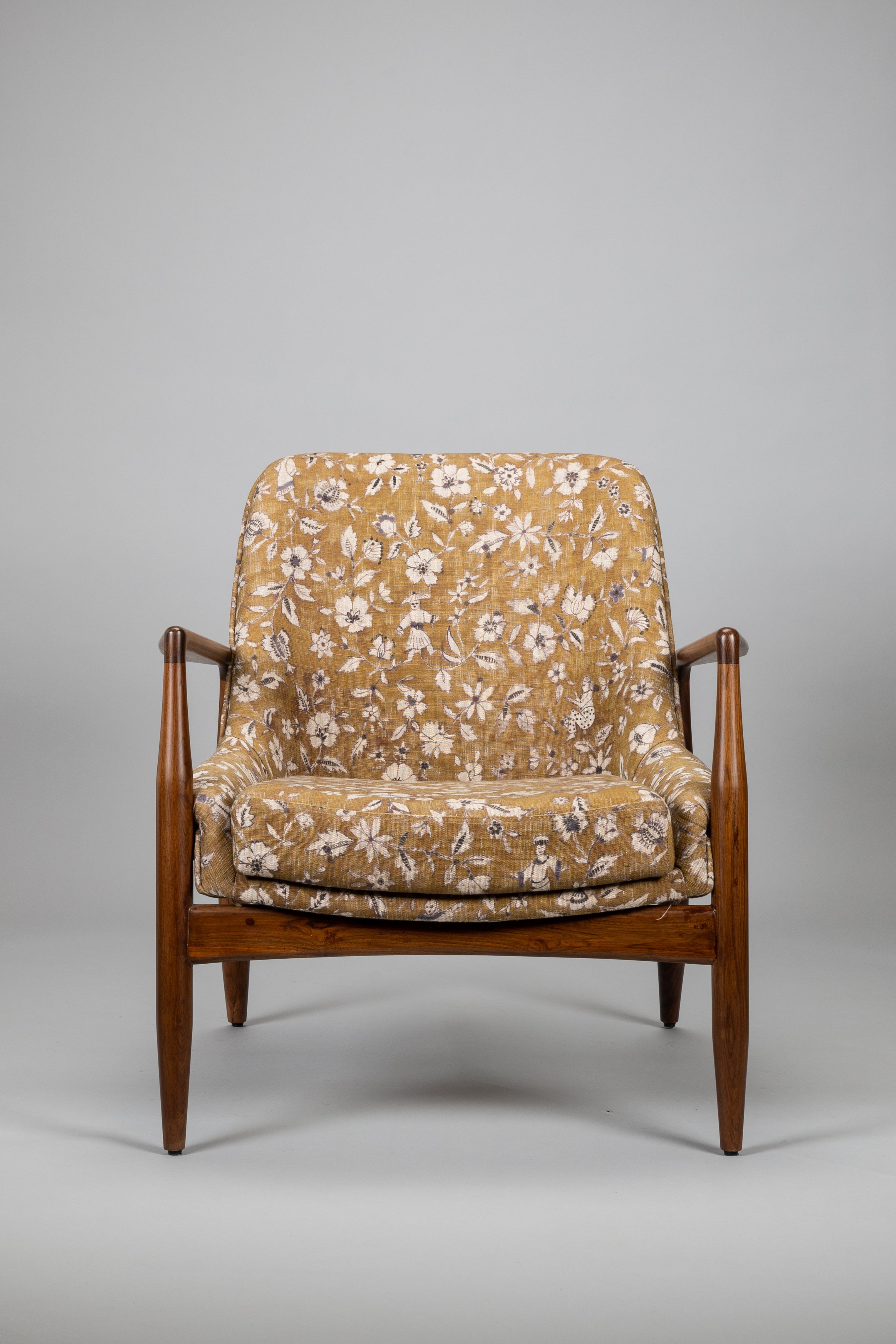 Floral-patterned armchair on a gray background