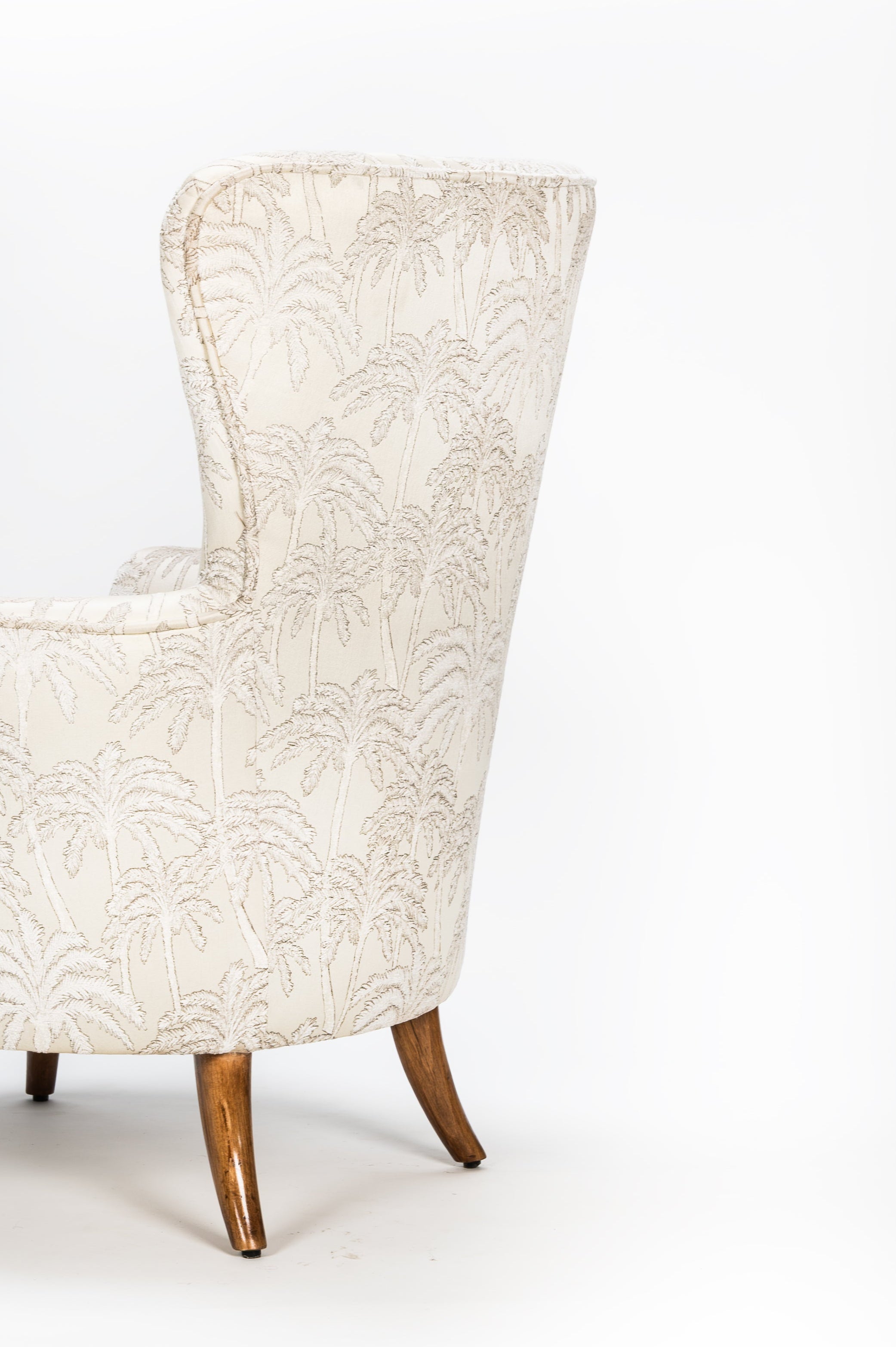 White upholstered armchair on a white background