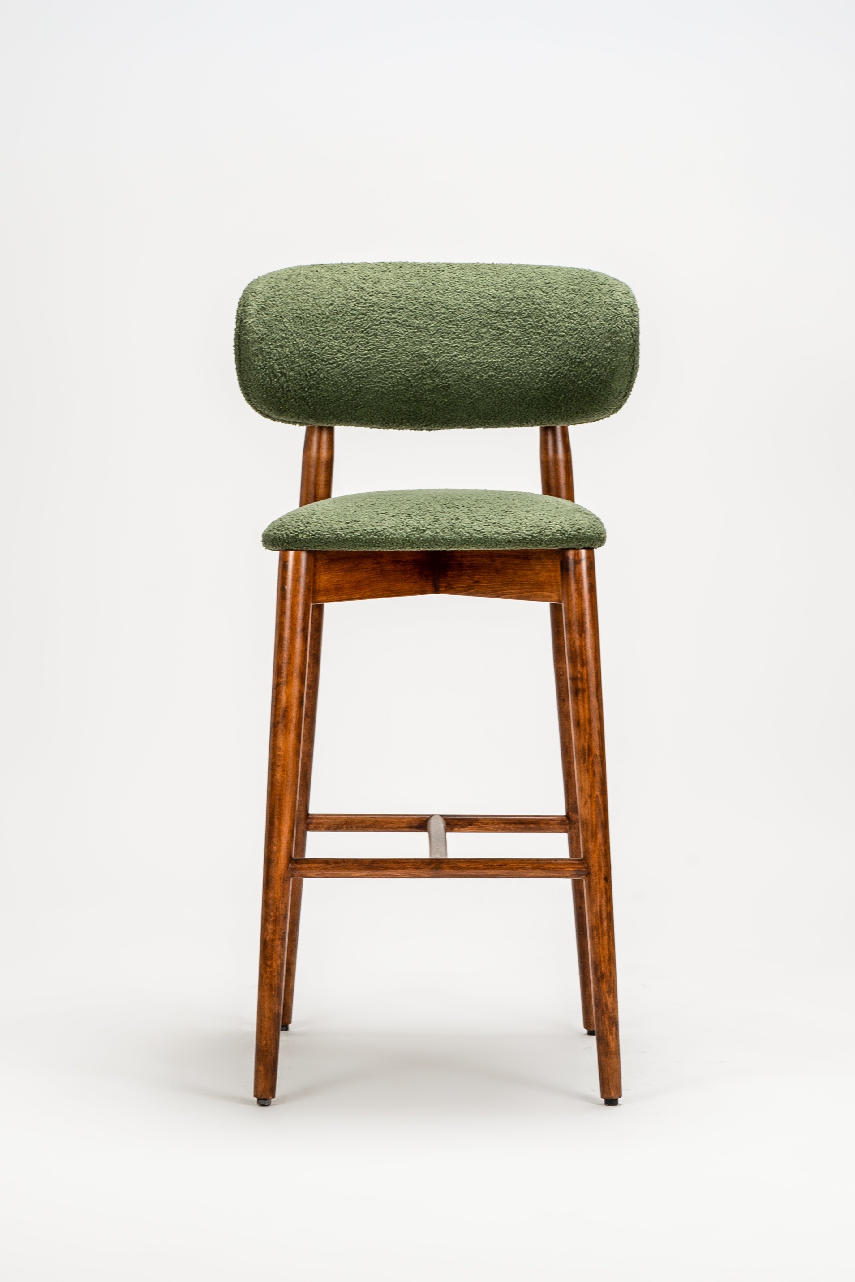 Green bar stool with wooden legs on a white background