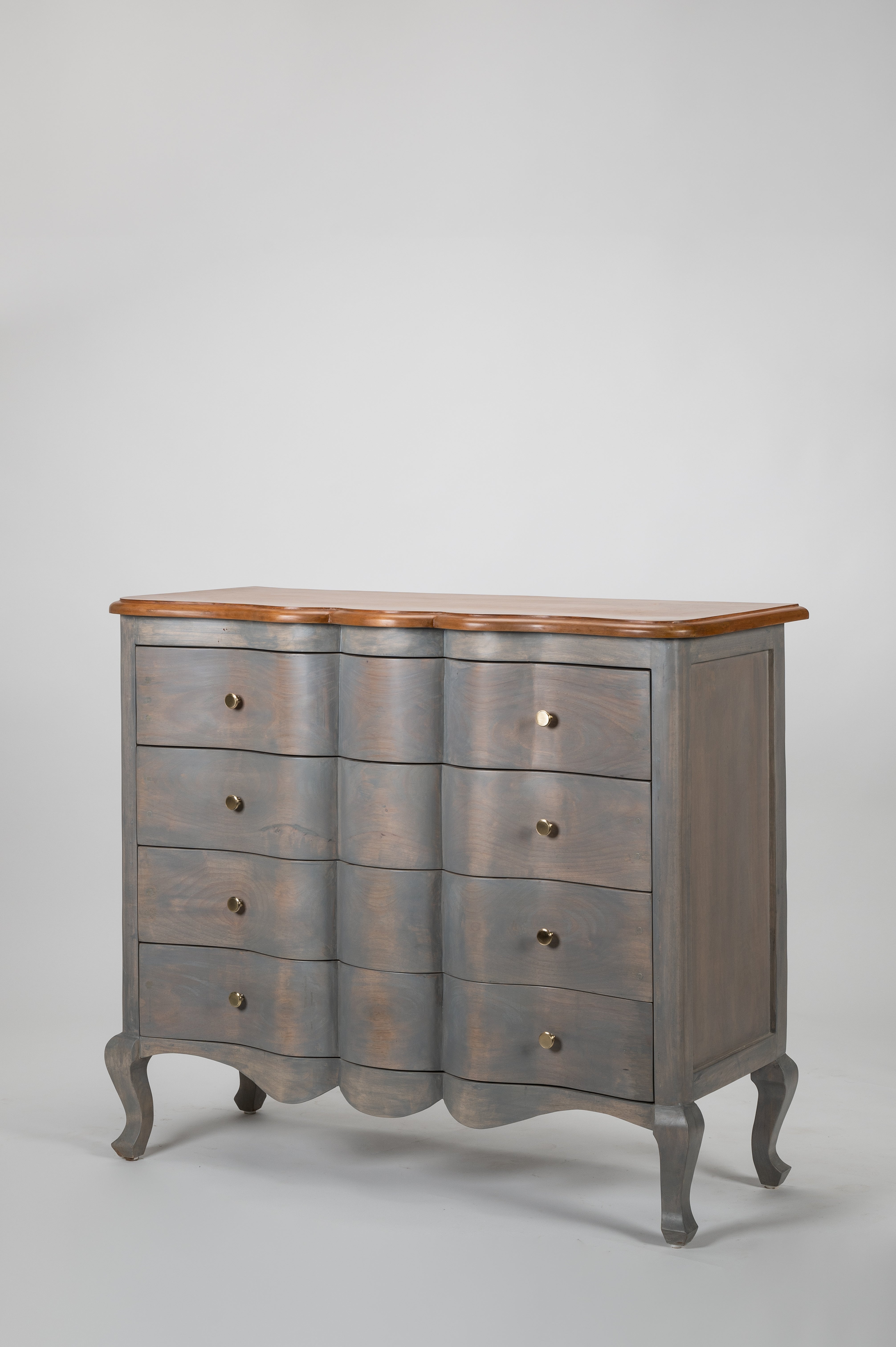 Wooden dresser with a gray finish and wooden top on a light gray background