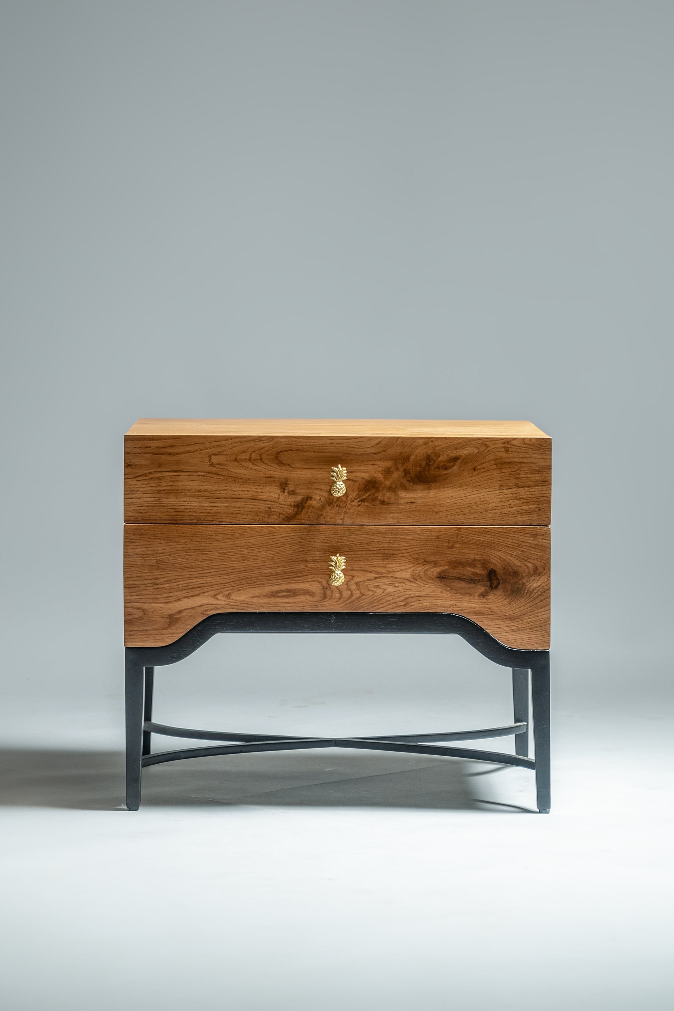 Wooden side table with metal legs on a gray background