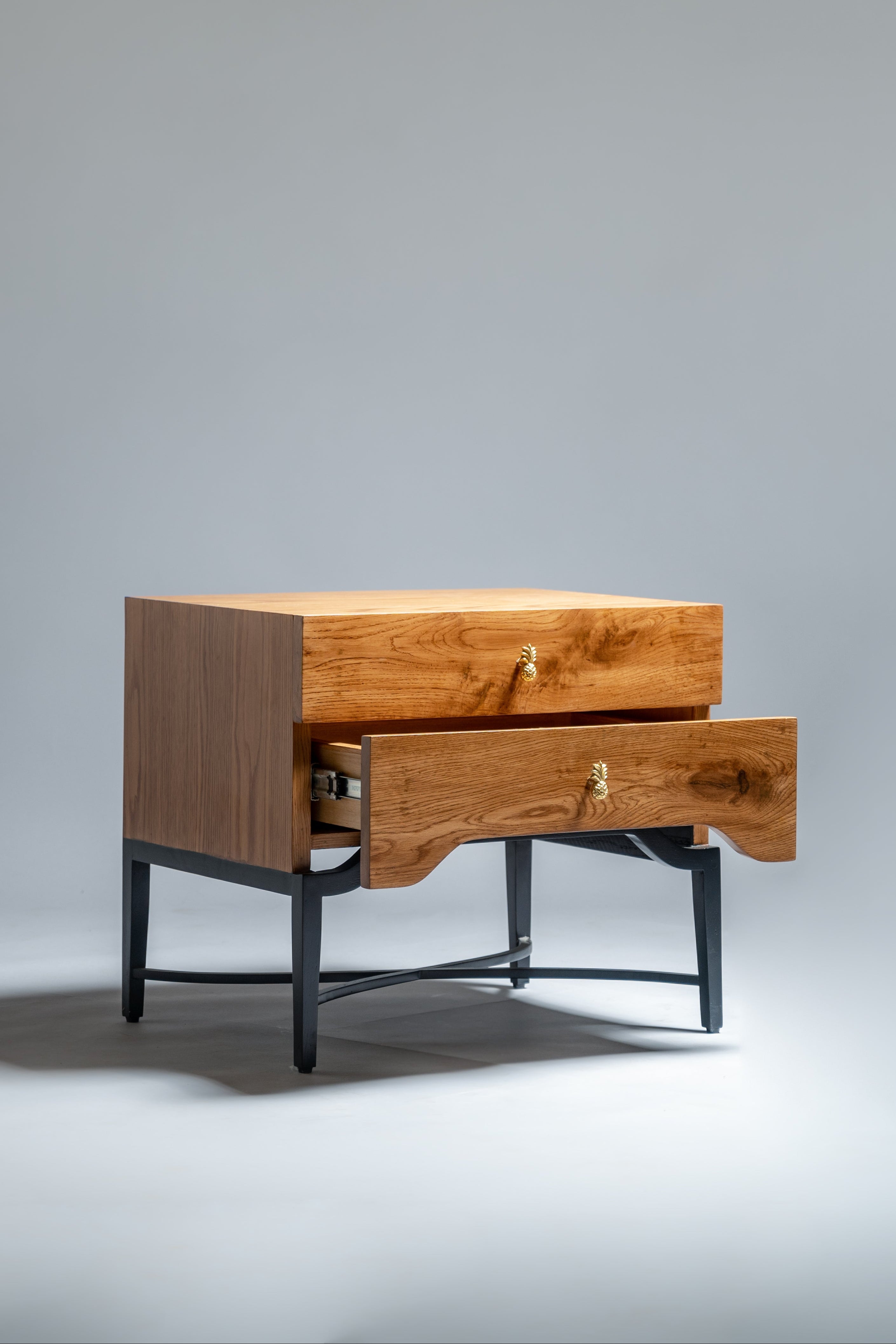 Wooden nightstand with a drawer on a gray background