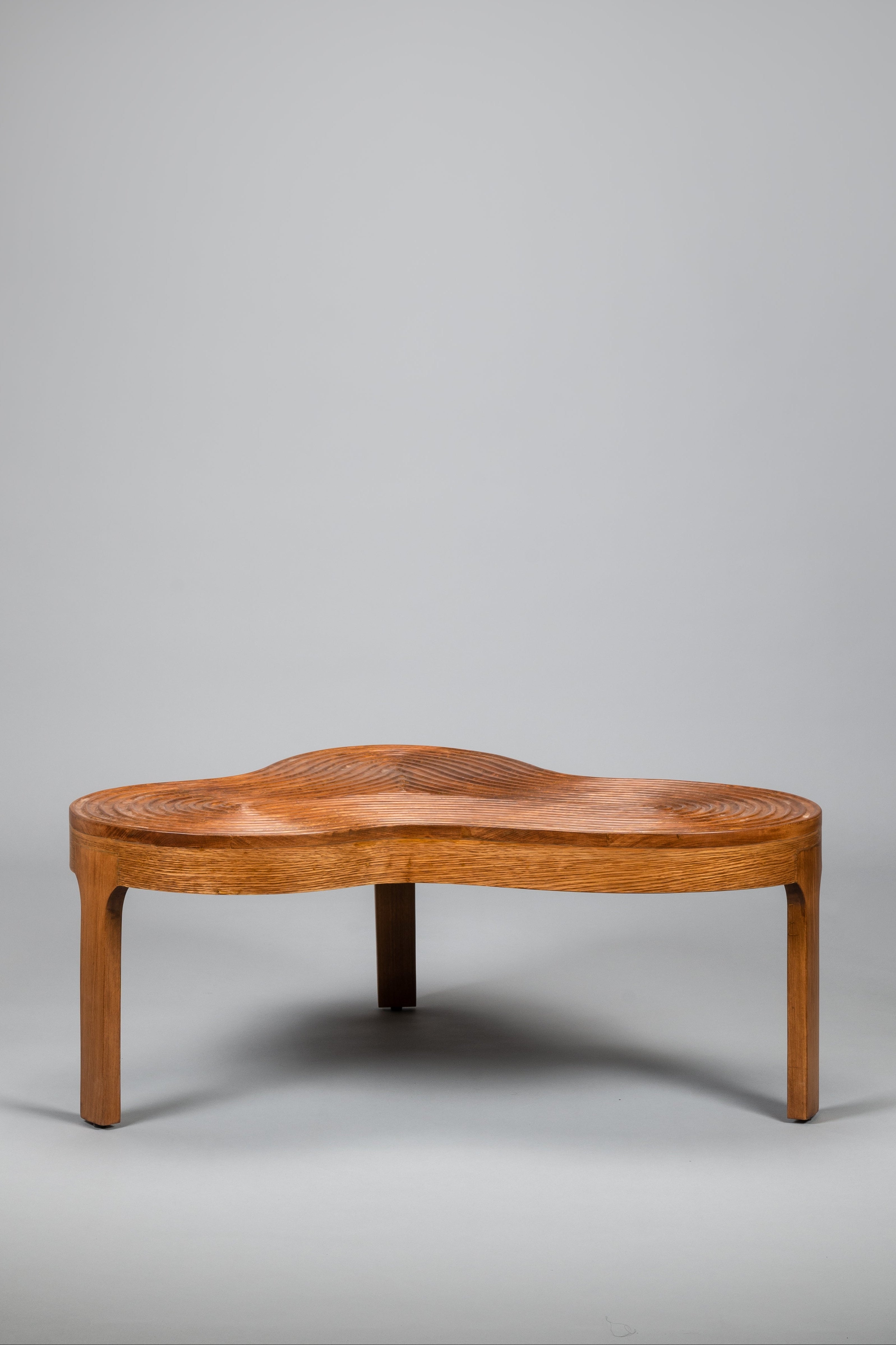 Wooden coffee table on a gray background