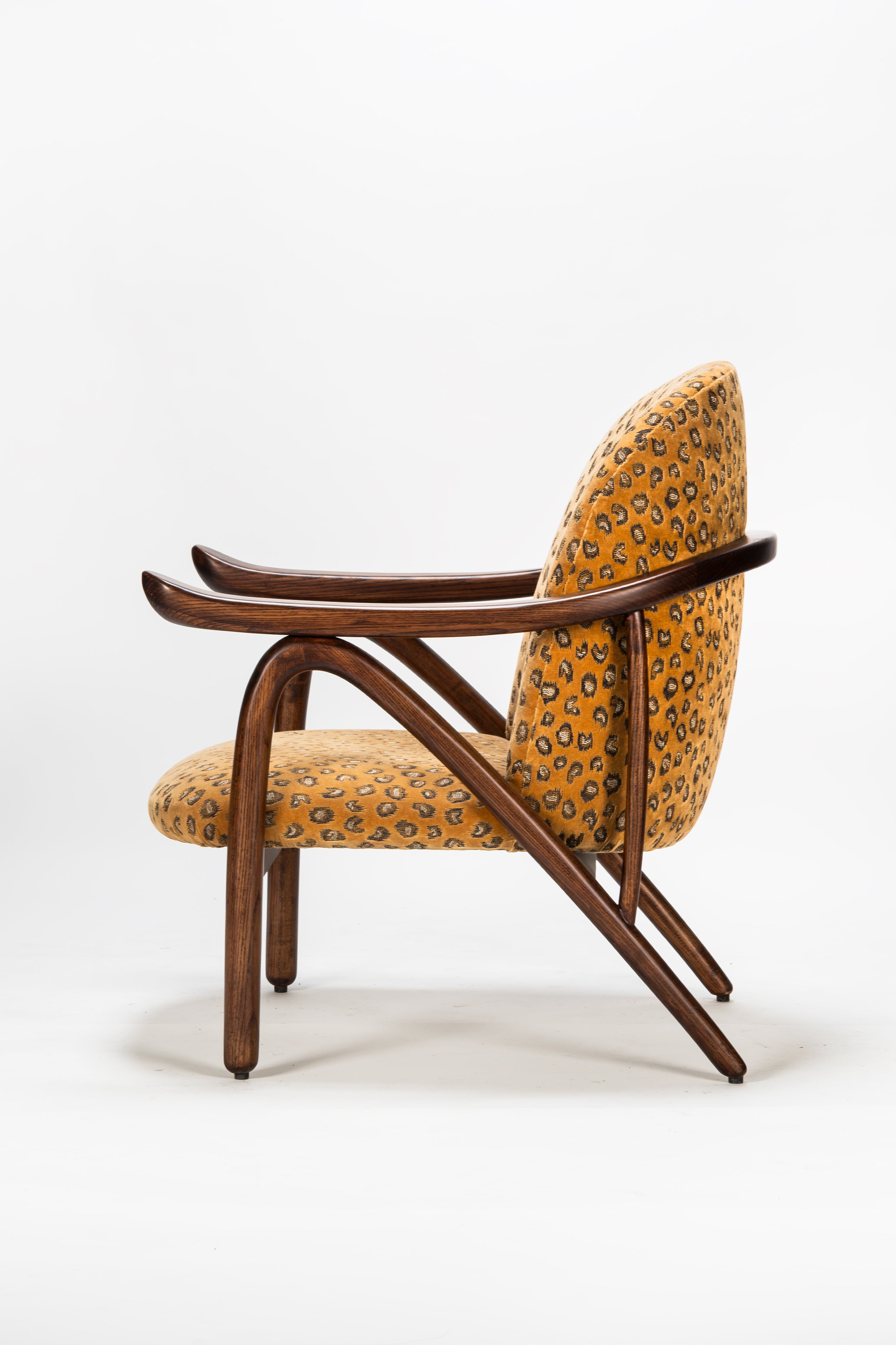 Chair with wooden frame and patterned cushion on a white background