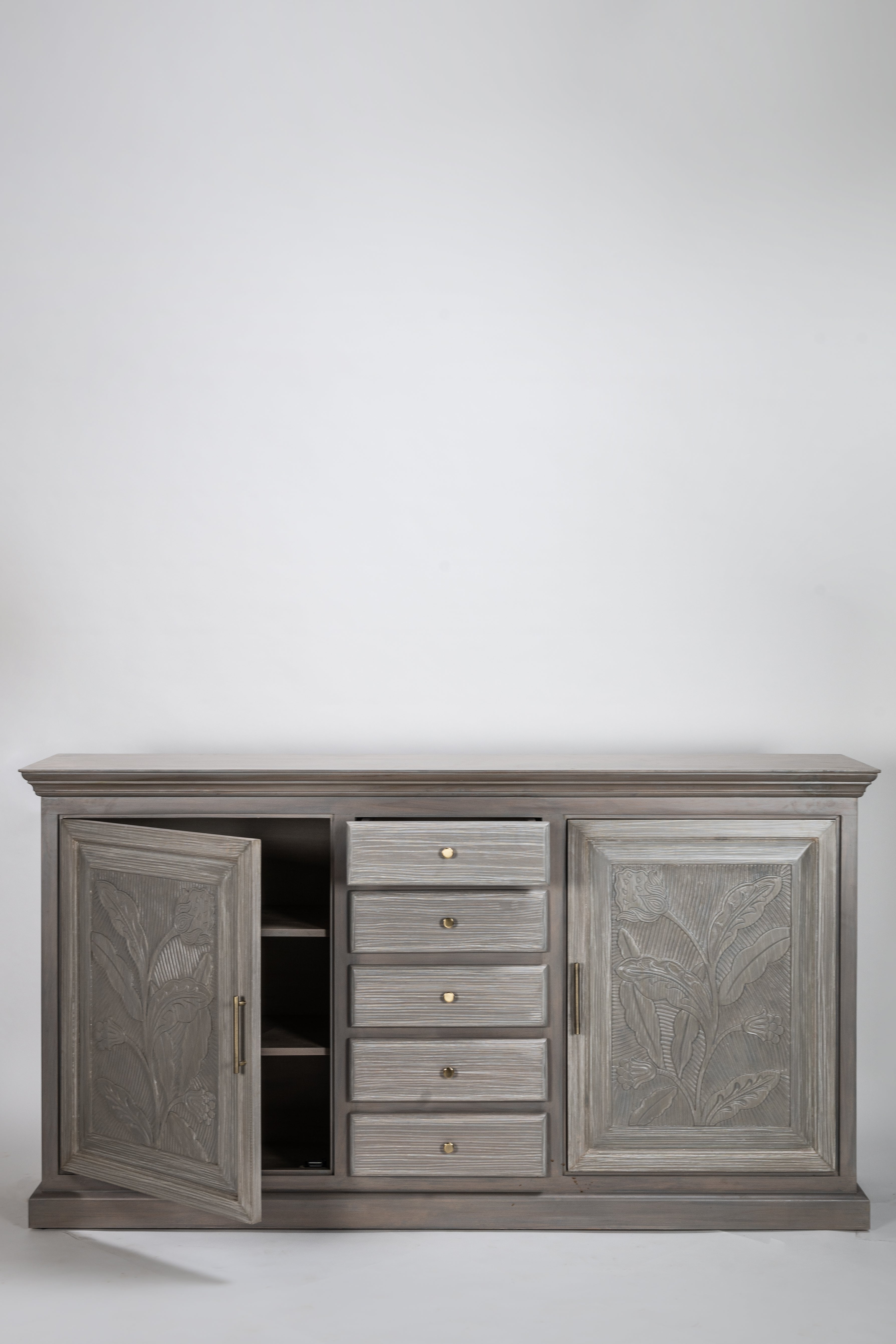 Gray wooden cabinet with two doors and a drawer on a white background